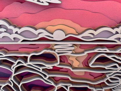 Décoration artisanale d'un tableau représentant un paysage coucher de soleil au design 3D fantaisiste